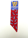 Doggie Dannas red with white polka dot and blue outlined white dog bones print bandana