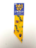 Doggie Dannas yellow with purple and green paw prints with "woof" print bandana
